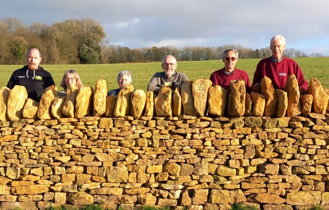 Volunteers celebrate walling accomplishment