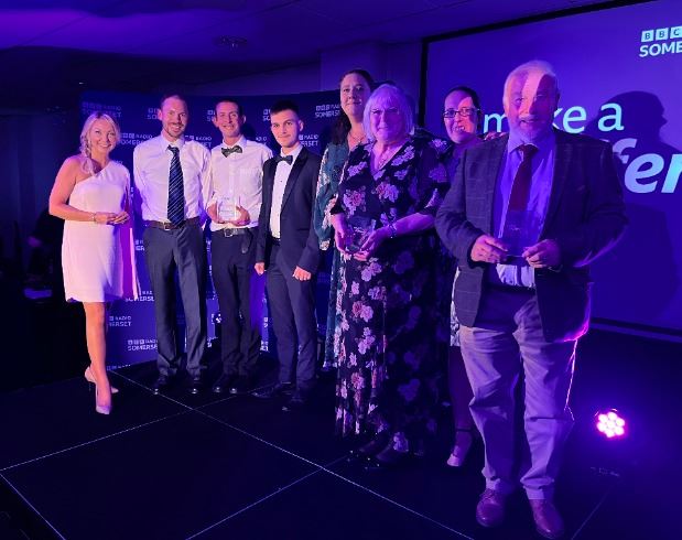 Volunteers receive runners up trophy at awards ceremony